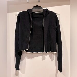 Brand New black with white trim sweater zip up with hood. Size Small